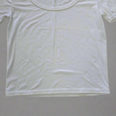 White t-shirt on a tiled floor